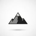 Geometric vector illustration of a mountain range composed of black and gray shades. The central Royalty Free Stock Photo