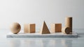 Geometric wooden shapes are arranged on a rectangular marble slab Royalty Free Stock Photo