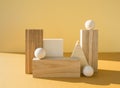 Geometrical figures composition. Three-dimensional wooden objects on yellow background. Balance, art and design concept.