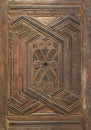 Geometrical and floral engraved patterns of Mamluk style wooden ornate door leaf Royalty Free Stock Photo