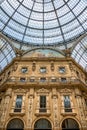 Geometrical and historical Interior of Galleria Vittorio Emanuele II in front of Cathedral of Milano, Milan, Italy