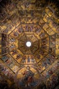 A vertical shot of a painting on cathedral ceiling with religious motives in Florence, Italy