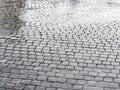 Geometrical pattern wet cobblestones Royalty Free Stock Photo