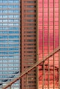 Geometrical patterns on building facade with sky and cloud reflections Royalty Free Stock Photo