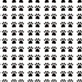 Geometrical seamless pattern with dog or cat pet paw flat icon silhouette. Simple black and white vector illustration background. Royalty Free Stock Photo