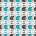 Geometrical seamless pattern with rhombuses and snowflakes. Royalty Free Stock Photo