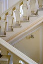 The geometry of a beige staircase with a candlestick in a 19th century mansion Royalty Free Stock Photo