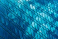 Geometry of a modern business center. Reflection in the glass windows of clouds on the skyscraper of a commercial modern Royalty Free Stock Photo