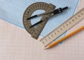Geometry set with compass,pencil,ruler on graph paper Royalty Free Stock Photo