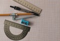 Geometry set with compass,pencil,ruler on graph paper Royalty Free Stock Photo