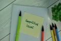 Geopolitical Issues write on sticky notes isolated on Wooden Table