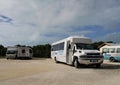 Tour buses and vans parked near the Exuma International Airport located near Moss Town, George