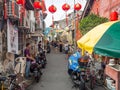 George Town Malaysia: Historical town lively streets full of shops and colonial houses and street food motorbike delivery Royalty Free Stock Photo