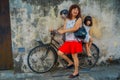 George Town, Malaysia - March 10, 2017: Little Children on a Bicycle, popular mural street art that unknown tourists