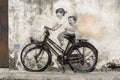 George Town, Penang, Malaysia, December 19 2017: `Little Children on a Bicycle` street art