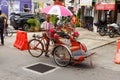 Rickshaw driver waiting for customer on Georgetown Street