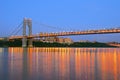 George Washington Bridge with NYC skyline at dusk