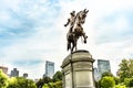 George Washington statue in Boston Common Park with city skyline and skyscrapers. Royalty Free Stock Photo