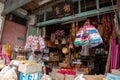 A woman read newspaper at the joss stick shop house.