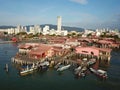 Aerial view boats anchor near the wooden bridgeal chinese clan settlements.