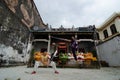 Chinese kungfu with knife in front of chinese temple.