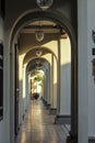 Arches of a colonnaded corridor in an old colonial building in the heritage town of