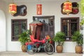 A bicycle parked outside a vintage house decorated with red lanterns in the heritage Royalty Free Stock Photo