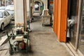 Old diesel generators on a rustic sidewalk pavement in George Town, Penang