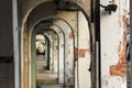 Vintage arches of a sidewalk alley lined with old shops and shrines in the world