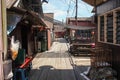 A wooden walkway through traditional stilt houses in the Clan jetties of a waterside