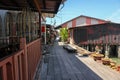 A wooden walkway through traditional stilt houses in the Clan jetties of a waterside