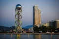 Georgia, Batumi-July 17, 2018. Ferris wheel and alphabet tower - sights of Batumi in the evening light, their outlines against the Royalty Free Stock Photo