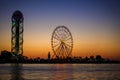 Georgia, Batumi-July 17, 2018. Ferris wheel and alphabet tower - sights of Batumi in the evening light, their outlines against the Royalty Free Stock Photo