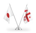 Georgia and Japan table flags isolated on white 3D rendering