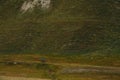 Georgia, Kazbegi region Truso Valley - 09.09.2023. Cyclist athlete in a bright blue jacket and wearing a helmet on his