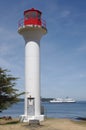 Lighthouse with passing ferry in the background Royalty Free Stock Photo