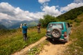 Georgia, Racha - August 13, 2015: A group of travelers enjoys the amazing view of the mountains Royalty Free Stock Photo