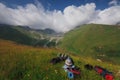 Georgia, Racha - August 17, 2013: The traveling girl rests against the backdrop of an amazing view