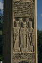 Georgia, Tbilisi - September 2023. A beautiful stone pillar with saints people and inscriptions of prayers on the