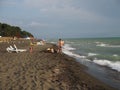 Georgia, Ureki - june, 2019: A crowd of people sunbathing on the beach , having fun