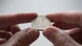 Georgian coin with a denomination of one lari in the hands of a man Royalty Free Stock Photo