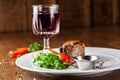 Georgian cuisine. Juicy beef steak, veal steak on a white plate with roasted rocket, grilled vegetables and sauce Royalty Free Stock Photo