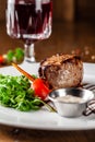 Georgian cuisine. Juicy beef steak, veal steak on a white plate with roasted rocket, grilled vegetables and sauce Royalty Free Stock Photo