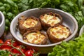 Georgian cuisine. Stuffed shampignon mushrooms with suluguni cheese baked in ketsi pan with greens and vegetables Royalty Free Stock Photo