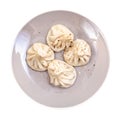 top view of boiled khinkali on gray plate isolated