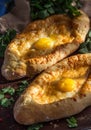 Georgian dish khachapuri ajaruli with egg and suluguni