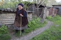 Georgian elderly lady walking and looking