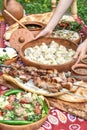 Georgian food Caucasian shashlik khinkali salad Dinner table Royalty Free Stock Photo