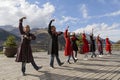 Georgian people in local dresses perform georgian folk dance.