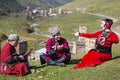 Georgian people in their traditional, local dresses have a nice time all together in the Caucasus Mountains.